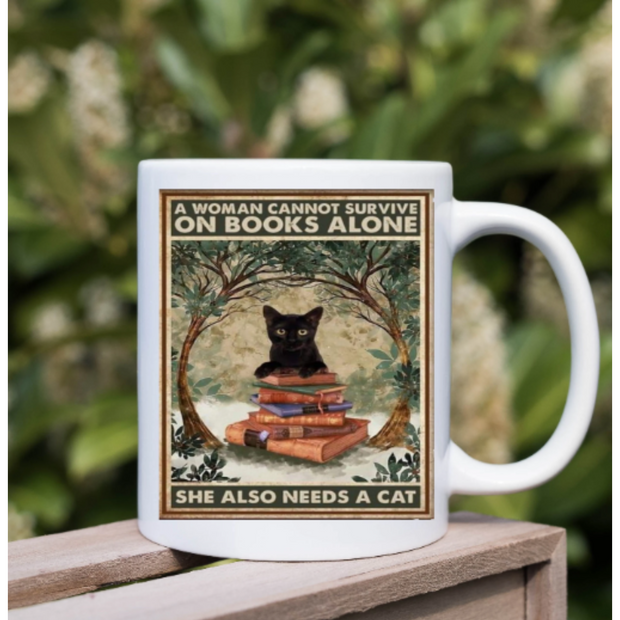 a women cannot survive on books alone she needs a cat,cat mug